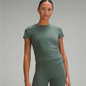 New with tag Lululemon All It Takes Short-Sleeve Dark Forest. Size 6.